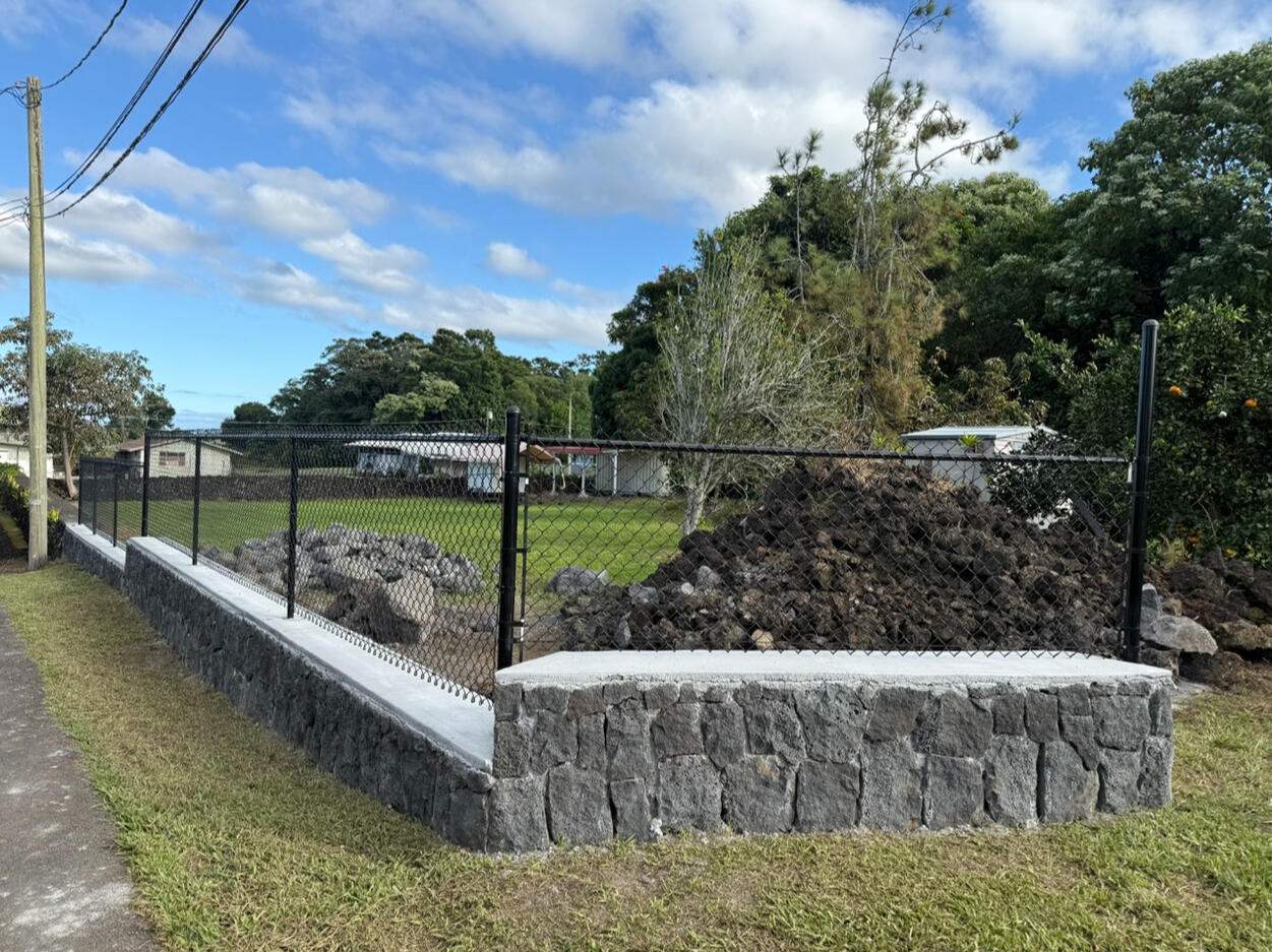 Rock wall with fencing